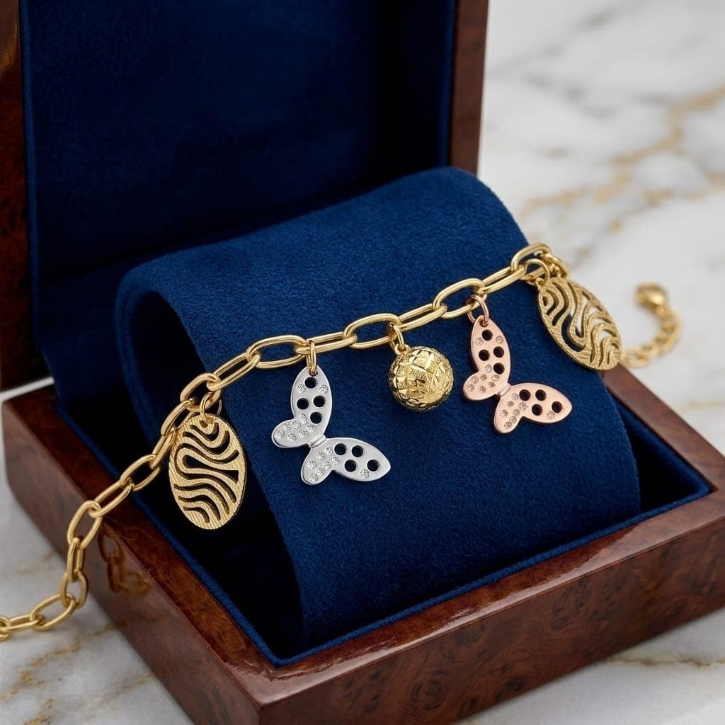 An elegant gold bracelet with luxurious clasp rings adorned with silver and pink butterfly pendants and attractive gold-colored hollow shapes, with an adjustable clasp to suit you. Women's Bracelets & Bangles (٤)