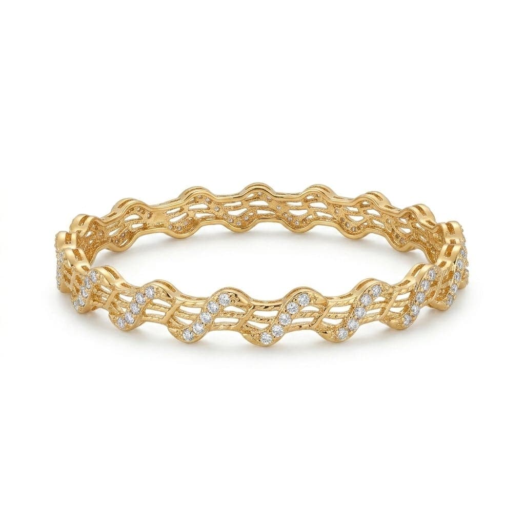 An elegant gold-tone bracelet with a flowing, wavy design that blends luxury and simplicity. Adorned with sparkling zircon stones and delicate engravings, it adds a touch of beauty to your look. Women's Bangles (3)
