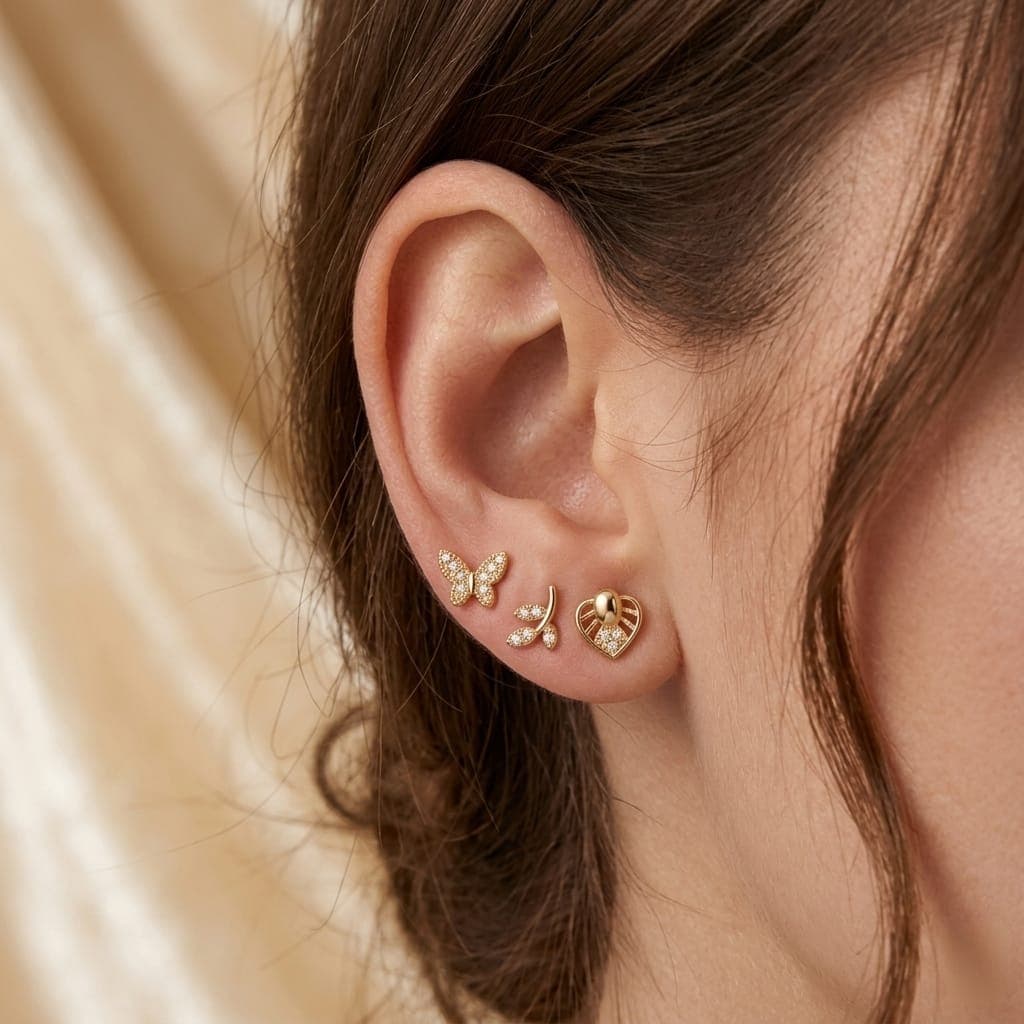 A set of 3 pairs of stud earrings in enchanting designs (butterfly, delicate branch, and sparkling heart) adorned with brilliant cubic zirconia stones. Shine with everyday versatility that combines luxury and elegance! Women's Earrings Stud (٢)