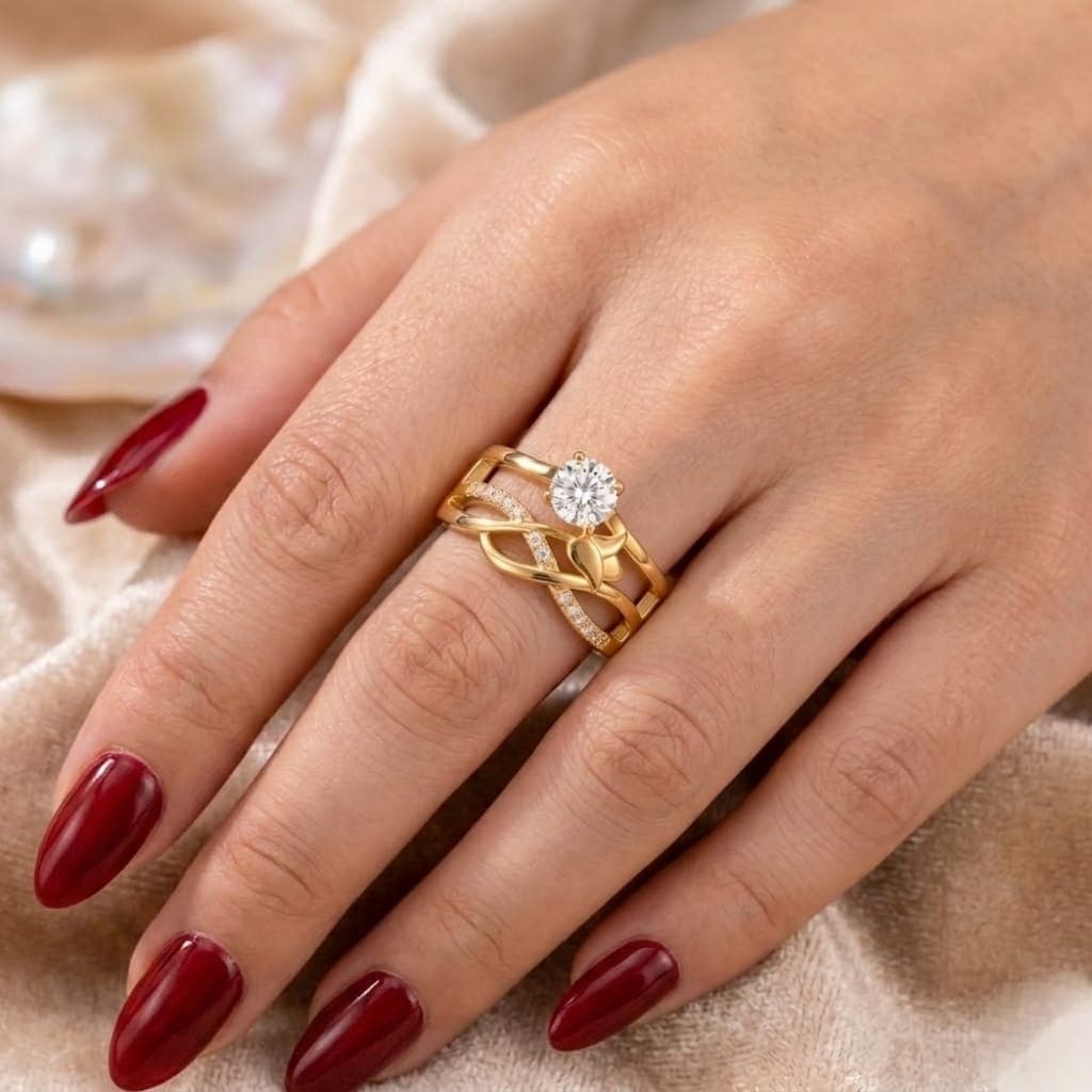 An elegant gold ring with an intricate design, adorned with delicate rows of sparkling zircon stones, and a shimmering central stone with an attractive gold leaf accent. It adds a touch of luxury to your look. Women's Rings (3)