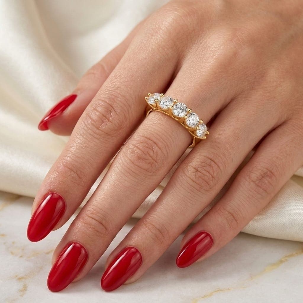 An elegant gold ring, studded with five sparkling round zircon stones, a delicate and attractive design that adds a touch of luxury and sophistication to your look at all times. Women's Rings (2)