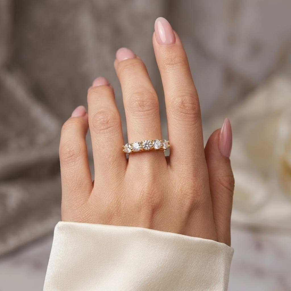 An elegant gold ring, studded with five sparkling round zircon stones, a delicate and attractive design that adds a touch of luxury and sophistication to your look at all times. Women's Rings (6)